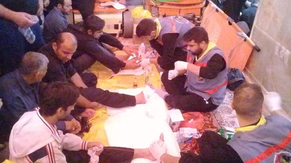 بالصور: الدفاع المدني الهيئة الصحية بخدمة زوار الامام الحسين داخل الحرم الشريف